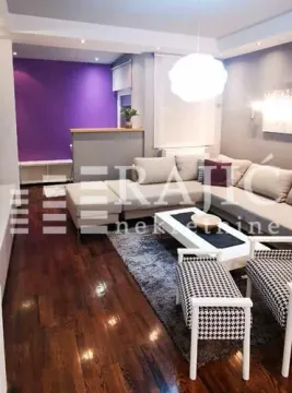Spacious living room with a sofa set and dining area. - image 4