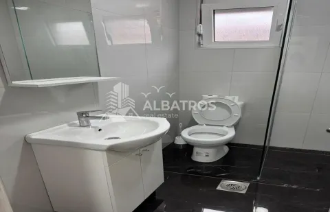 Smaller bathroom with a sink, mirror, and toilet. - image 8