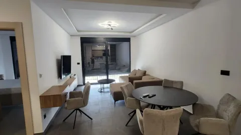 Living room with dining area and sofa set. - image 4