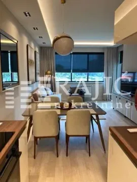 Modern living room with dining area and recessed lighting. - image 8