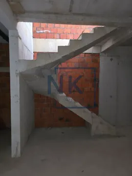 Concrete staircase in a building under construction. - image 7