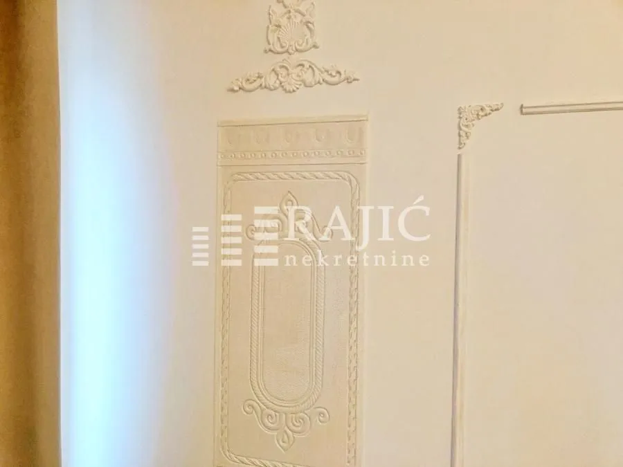 Detail of decorative plaster work on the interior wall.