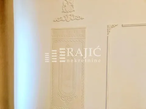 Detail of decorative plaster work on the interior wall. - image 4