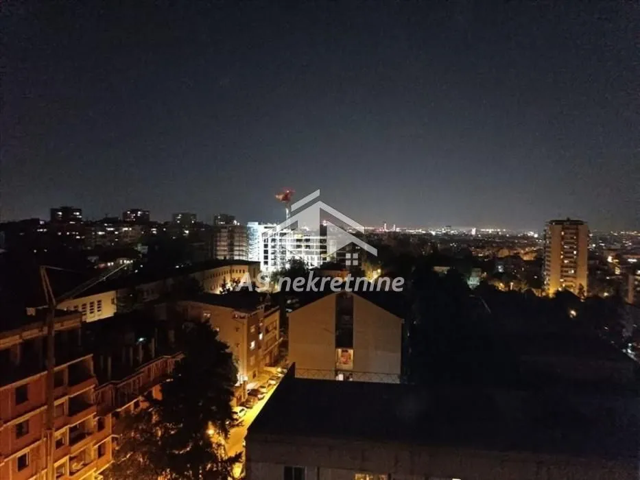 Night view of the city from the terrace or window.