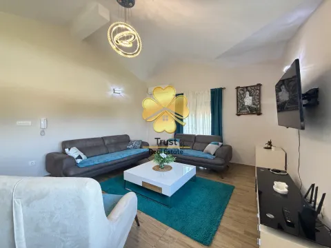 Spacious living room with a sofa set, coffee table, and modern lighting. - image 5