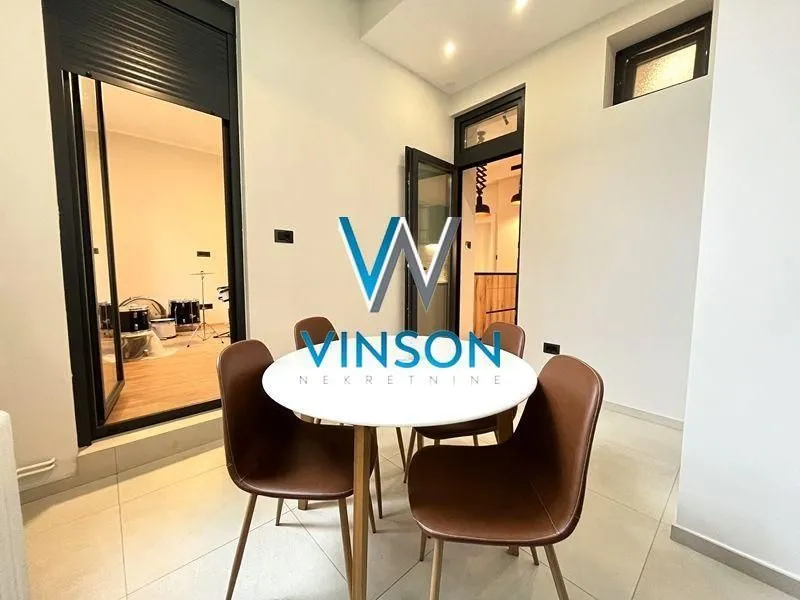 Living room with a dining table and chairs.