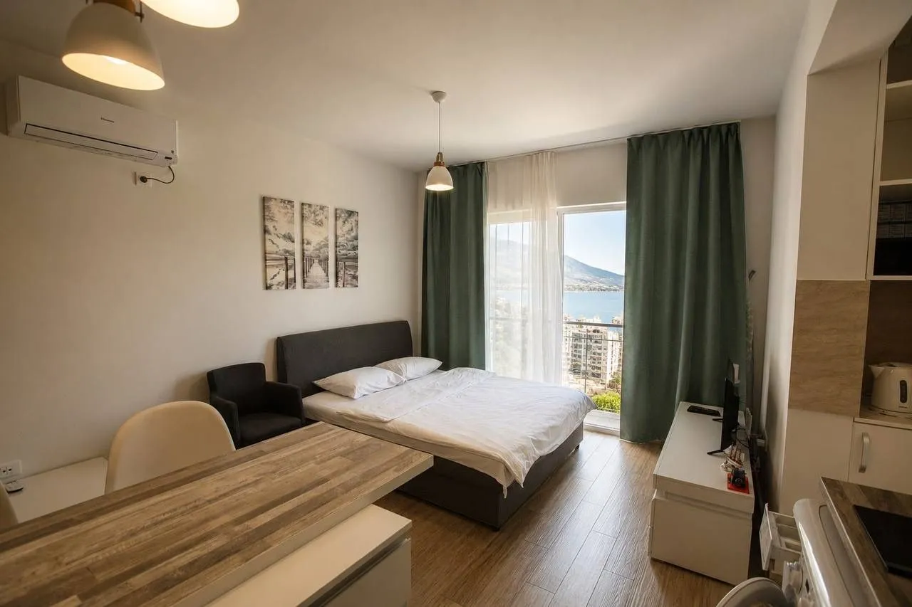 Master bedroom with a double bed and sea view.