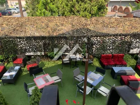Elevated view of the courtyard with outdoor seating and canopy. - image 6