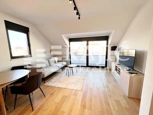 Bright living room with dining area and terrace access.