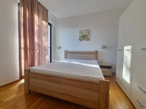 Bedroom with a double bed, white wardrobe, and wooden flooring. - image 2