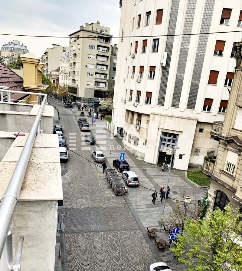 View of the city street and surrounding buildings from the terrace.