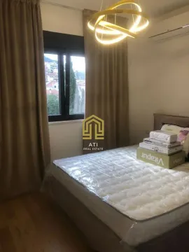 Bedroom with a bed and window. - image 13
