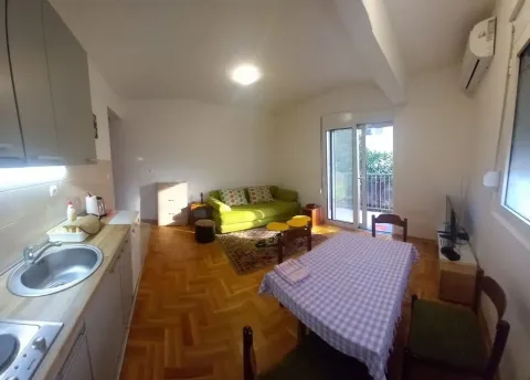 Living room with kitchen and dining area. - image 3