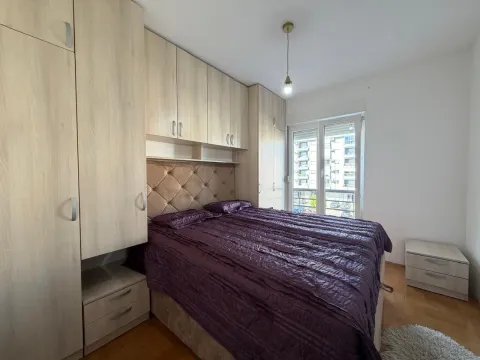 Furnished bedroom with a large double bed and fitted wardrobes. - image 9