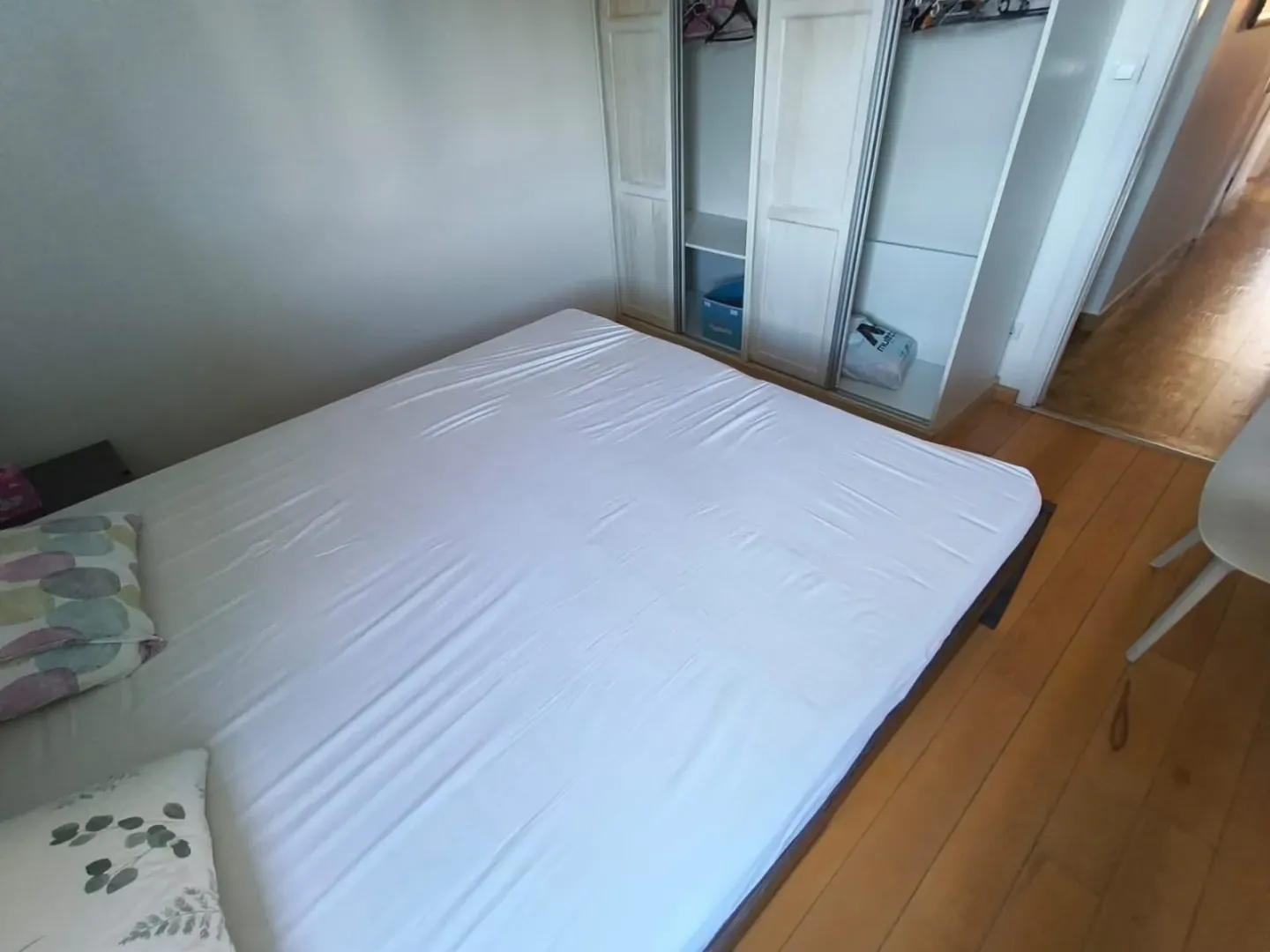 Bedroom with a double bed and a built-in wardrobe.