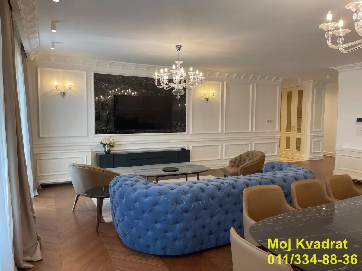 Spacious living room with a sofa set and TV.