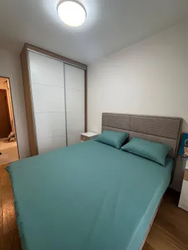 Furnished bedroom with a double bed and built-in wardrobe. - image 6