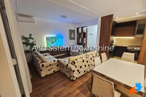 Living room with dining area and kitchen in the background. - image 6