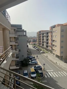 View from the terrace overlooking the street and surrounding residential buildings. - image 15