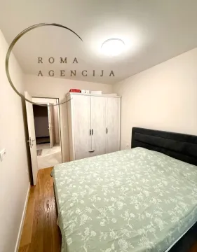 Furnished bedroom with a double bed and wardrobe. - image 5