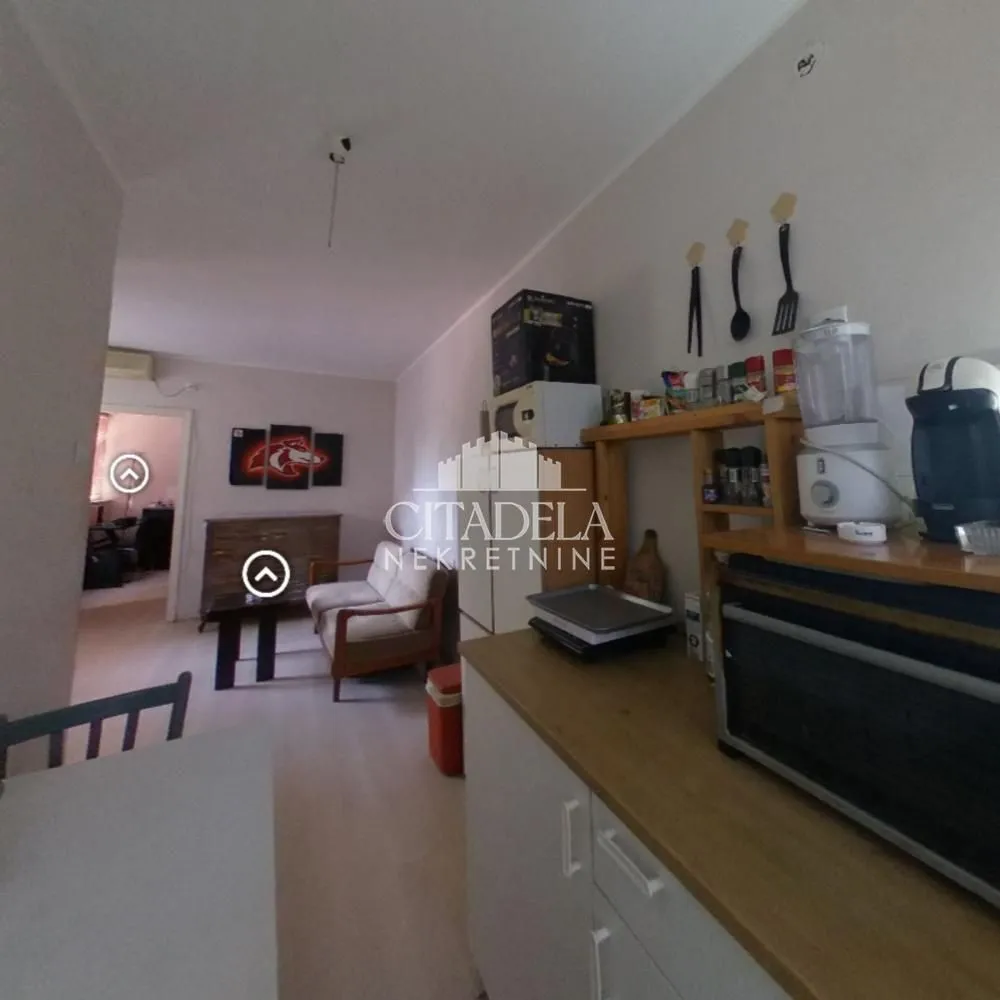View from the kitchen towards a small living room.