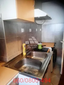 Smaller kitchen with a sink, cabinetry, and a hot plate. - image 3