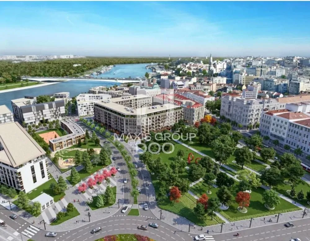Pogled iz vazduha na urbani kompleks sa parkom i rekom.