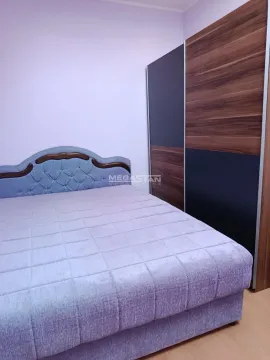 Bedroom with a double bed and a large fitted wardrobe. - image 10
