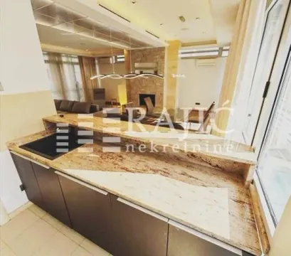 Modern kitchen with a breakfast bar overlooking the living room. - image 11