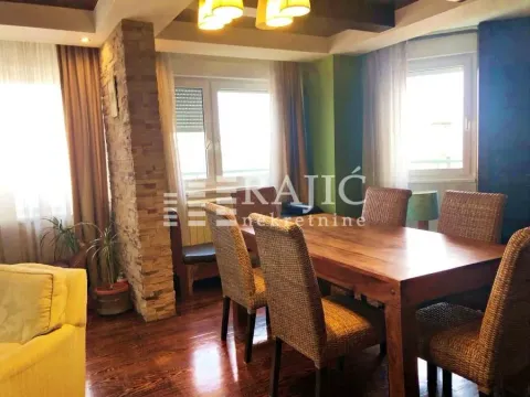 Dining area with wooden table and chairs. - image 12