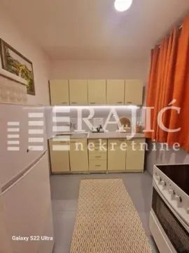 Small equipped kitchen with wall cabinets and appliances. - image 5