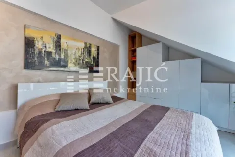 Furnished bedroom with a double bed and built-in wardrobes. - image 18
