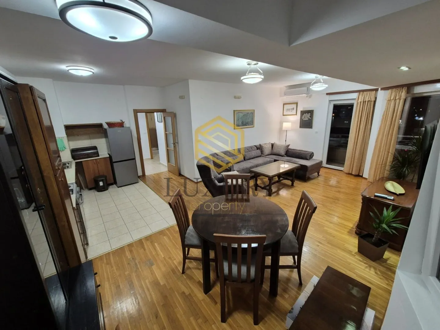 Spacious living room connected to the dining area and kitchen.
