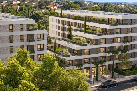 Pogled na spoljašnjost moderne stambene zgrade sa uređenim terasama i zelenilom. - image 3