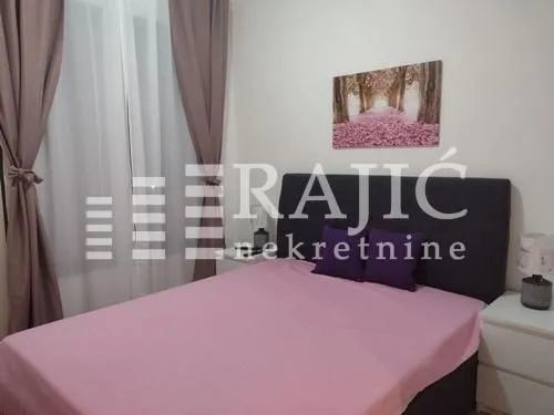 Furnished bedroom with a double bed.