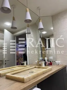 Modern bathroom with two sinks and a mirror. - image 5