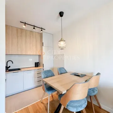 Small kitchen with a dining table and chairs. - image 4