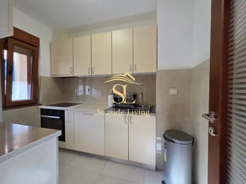 Small kitchen with light cabinetry and built-in oven. - image 6