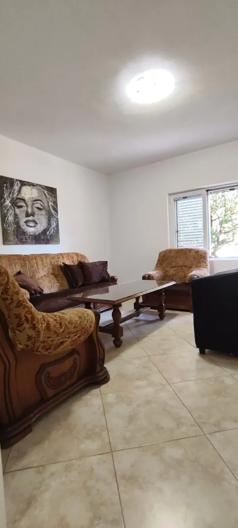 Living room with sofa set and coffee table.