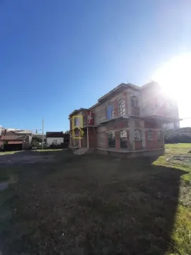 Exterior view of a house under construction with a large yard. - image 3