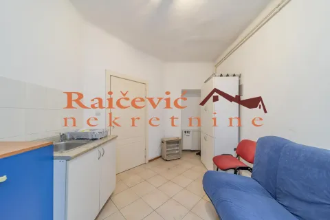 Small kitchen with a sink, cabinets, and a sofa in the continuation of the room. - image 16