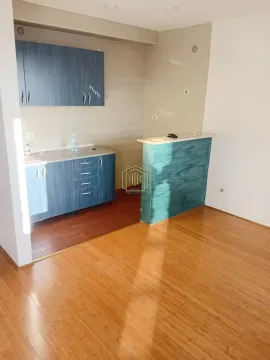 Small kitchen with blue cabinets and parquet flooring in the front area. - image 6