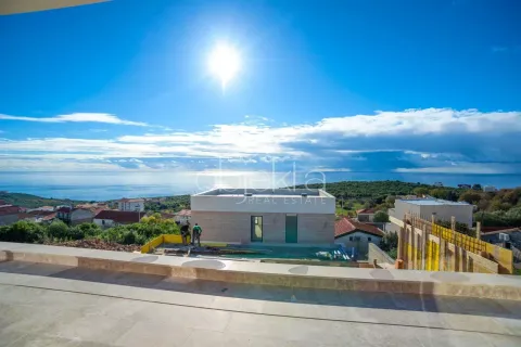 View of a house under construction from the terrace with the sea in the background. - image 5