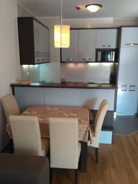 Modern kitchen with dining table and chairs. - image 3