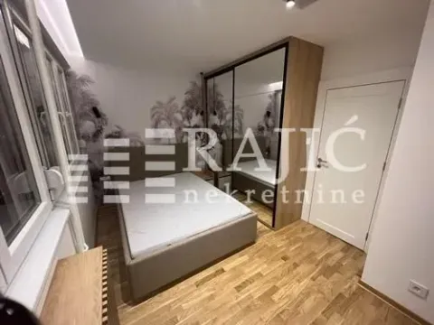 Modern bedroom with a double bed, large mirrored wardrobe, and wooden flooring. - image 5