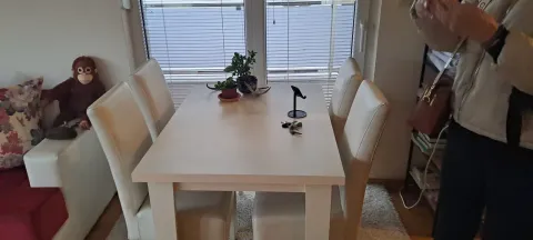 Dining table with chairs in the living room. - image 5