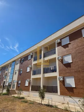Exterior of a smaller residential building with balconies and a wood-paneled facade. - image 9