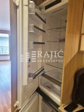 View of an open built-in refrigerator in the kitchen. - image 4