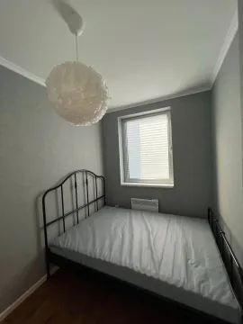 Small bedroom with a double bed and a window. - image 11