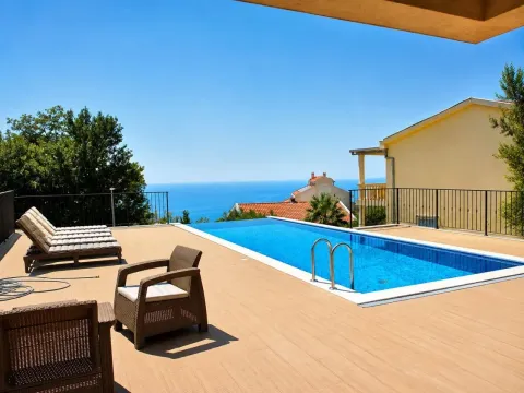 Spacious terrace with a swimming pool and sea view. - image 5